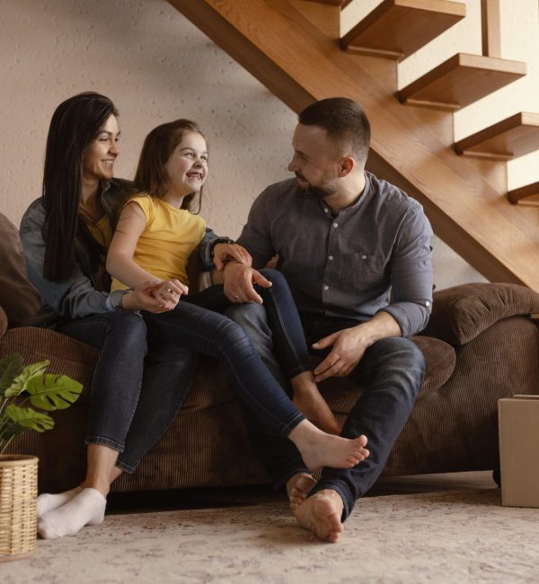 full-shot-parents-kid-couch